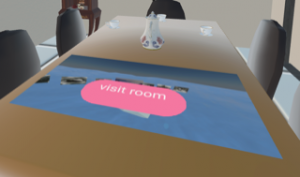 A digital living room table with a small tea set and a large blue rectangle that seems to show an ocean with objects floating in it. Text on the rectangle reads "visit room" 