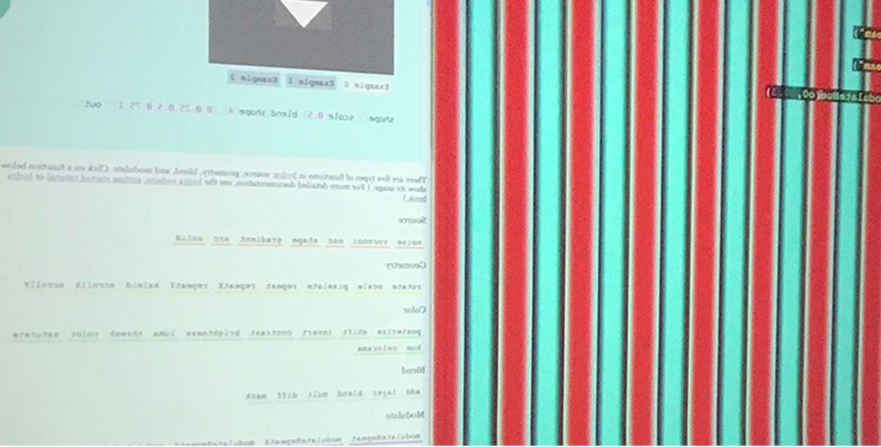 Abstract decorative image of a digital screen covered in red, black and teal vertical stripes and boxes of computer code.